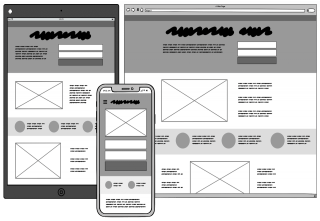 Un bureau sur lequel sont disposés des feuillets représentant les pages du sites sur lesquels le contenu est dessiné