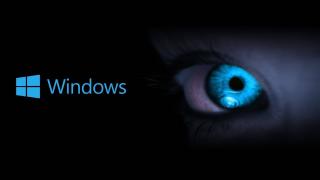 Fond noir. A gauche le logo Windows bleu. A droite une moitié de visage de femme avec un oeil bleu.